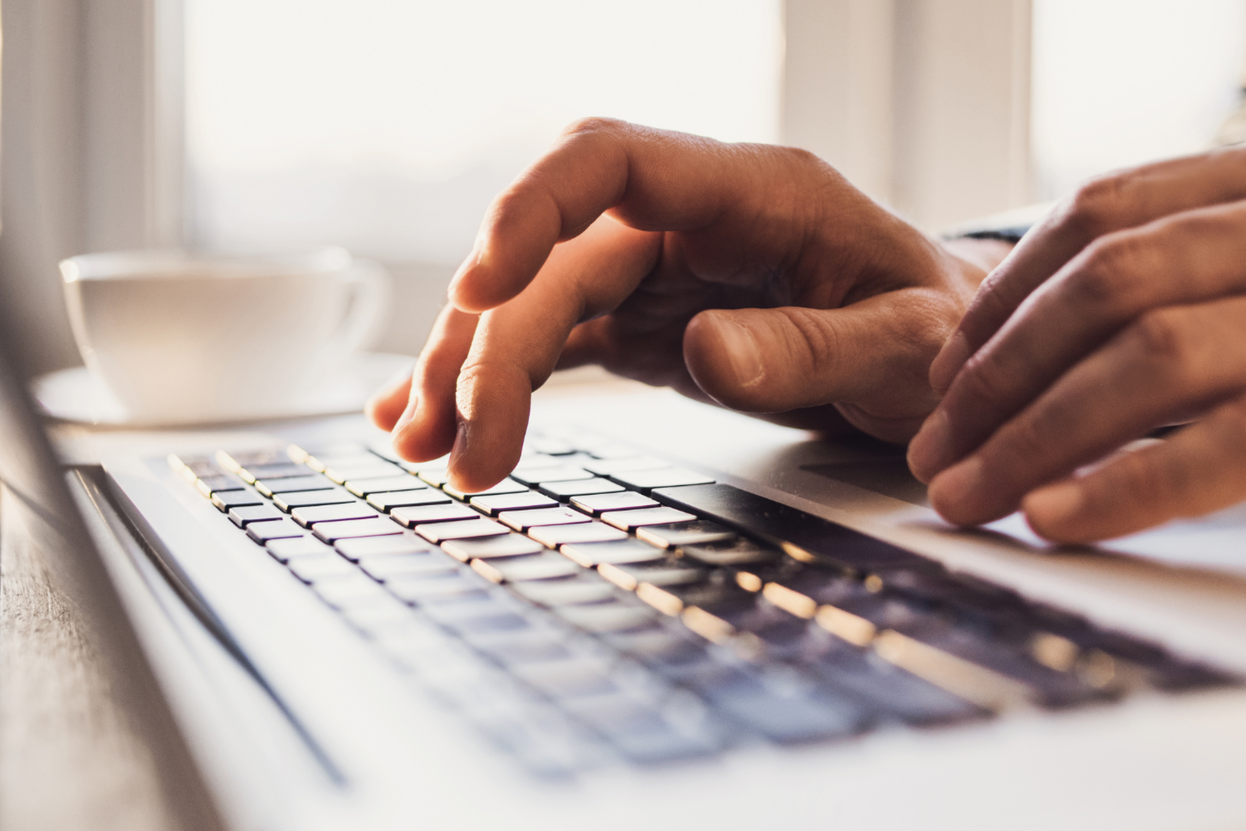 SRDC hands using laptop