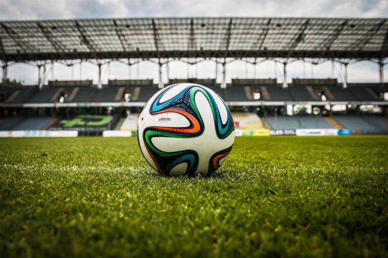 A photograph of a football in a football stadium.