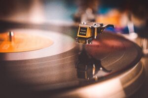 A close up photograph of a vinyl on a record player.