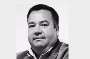 A portrait of Simon Renault, Business Director at Centre for Digital Public Services Wales.
