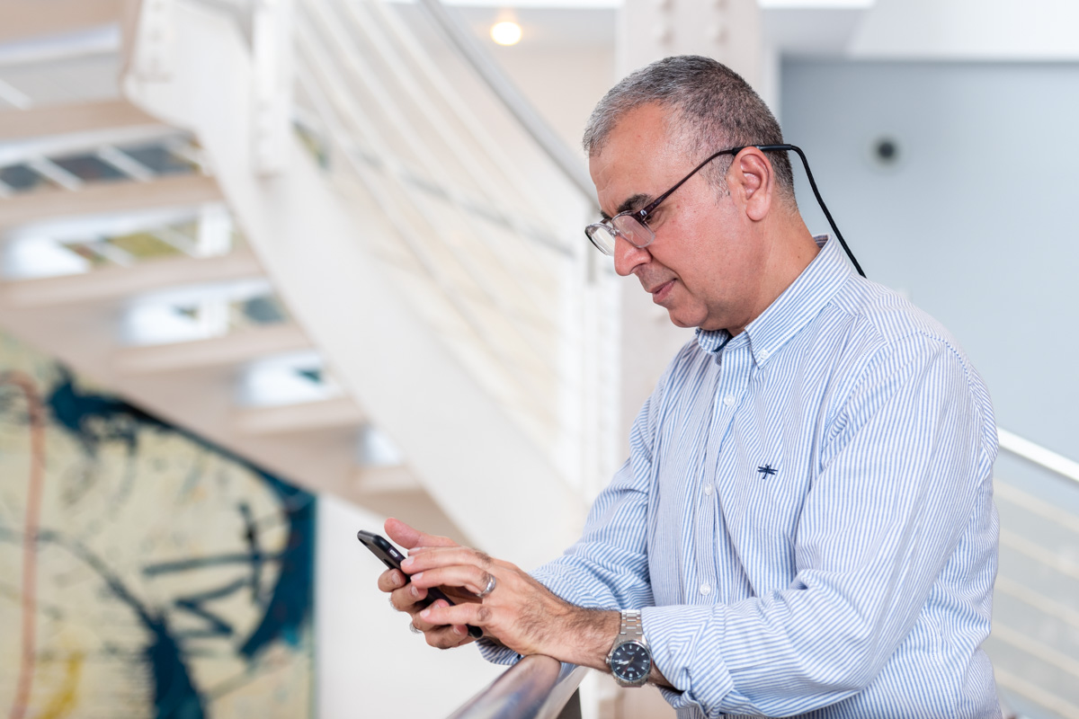 Older man looking at mobile phone