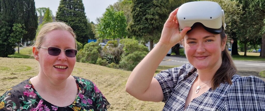 Colleagues at Swansea Bay University Health Board pose for a picture with a VR headset