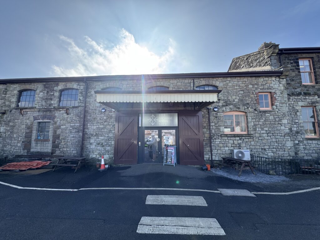 outside of a building with sun over it